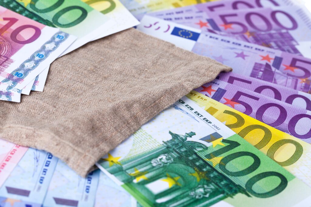 brown textile on white printer paper. Euro paper money image.
