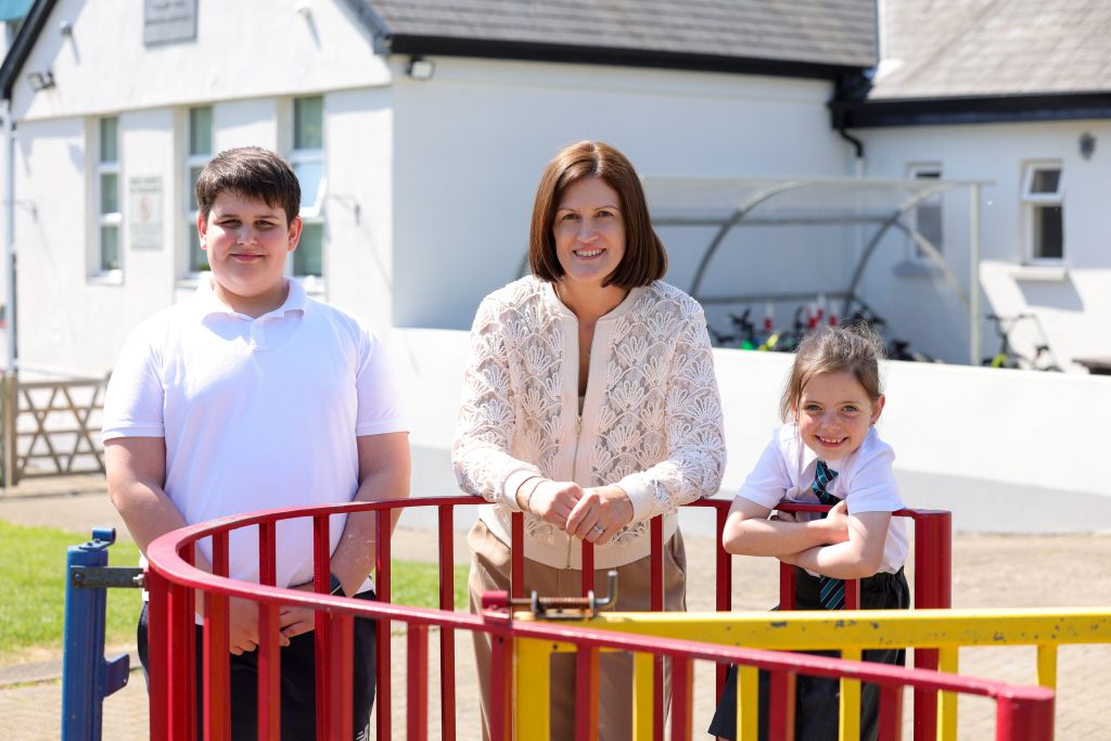 students standing with their teacher
