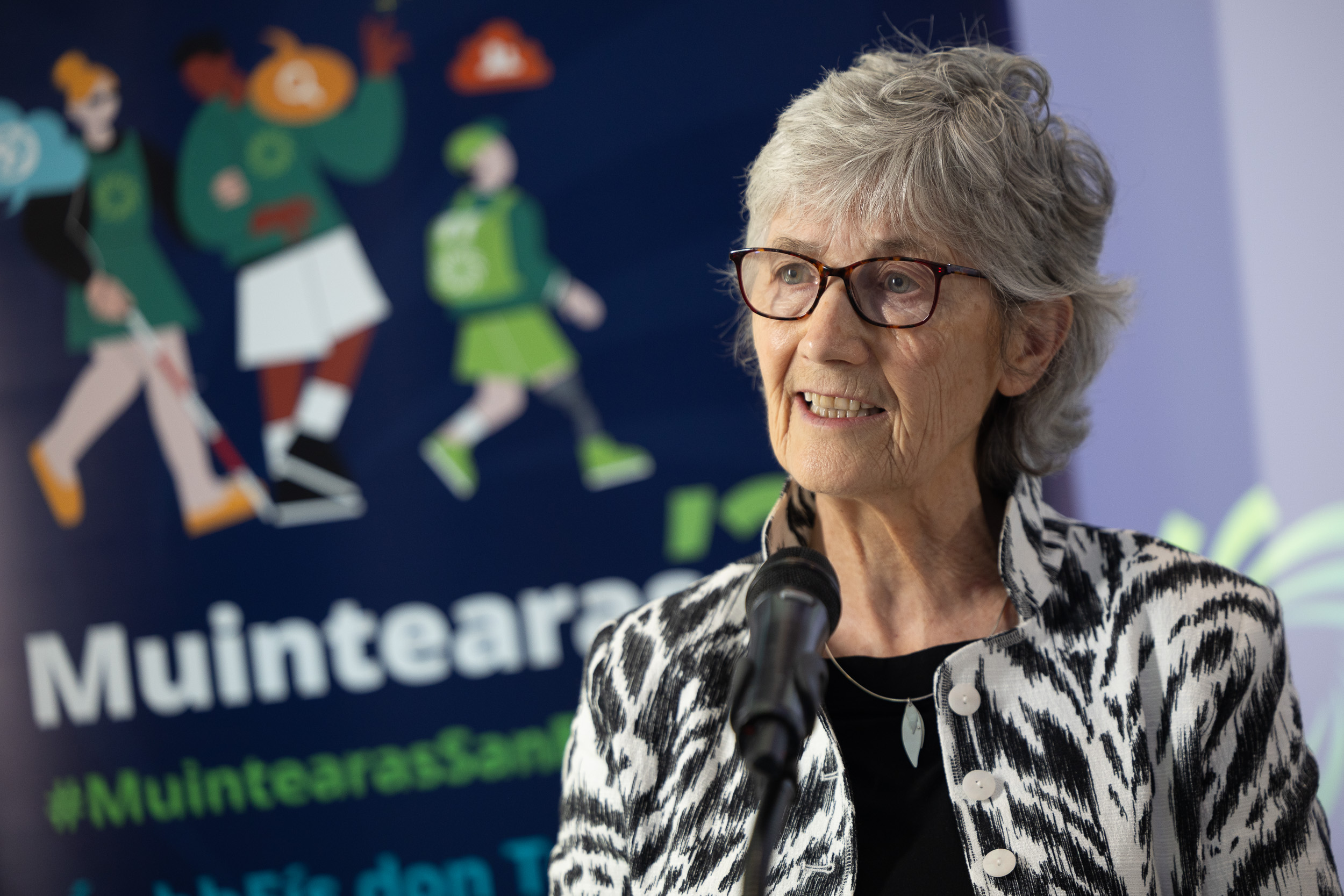 ETBI representatives posing with a sign that says Lets Talk Ethos