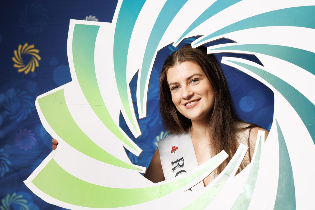 Girl posing inside ETB logo