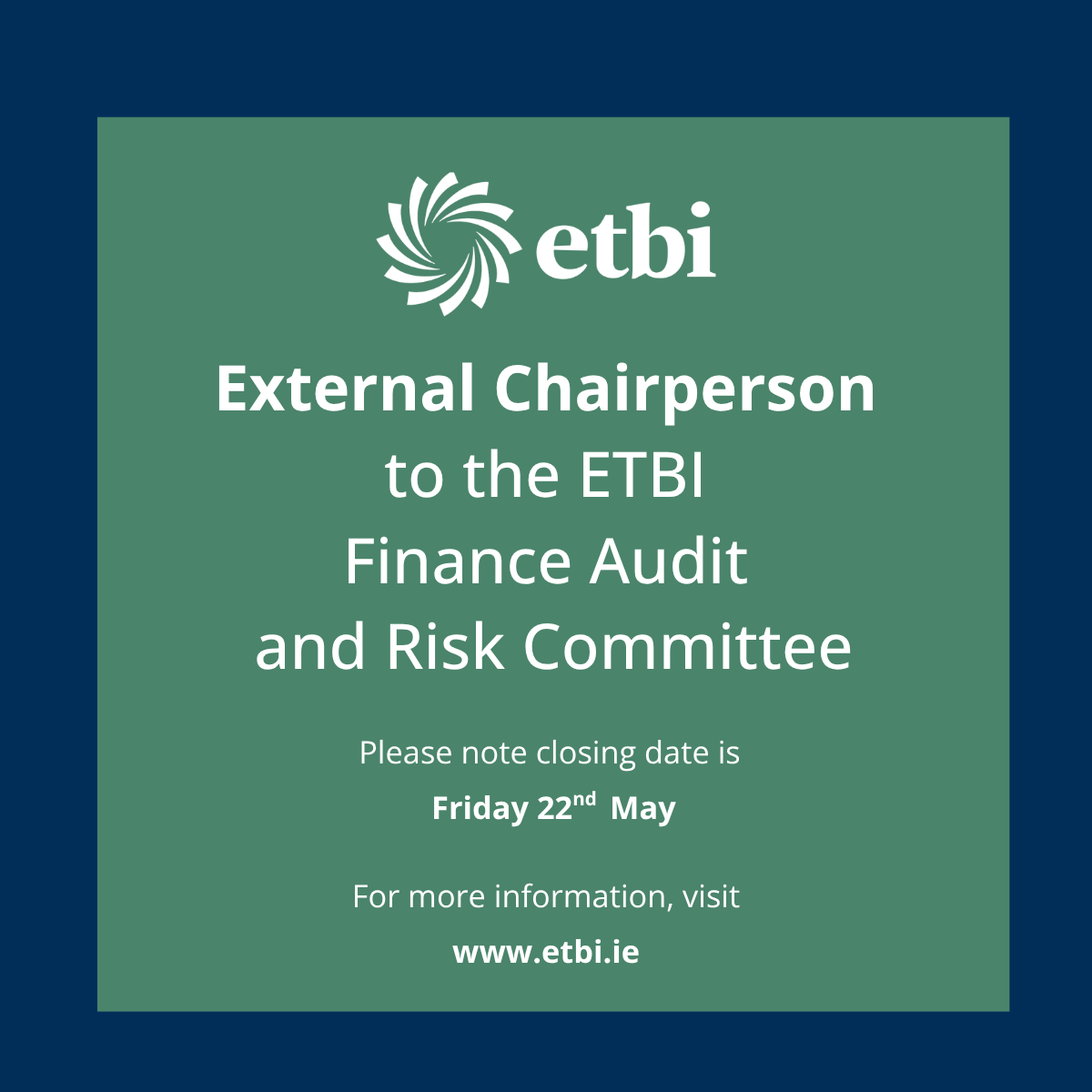 Man and woman posing in front of large screen